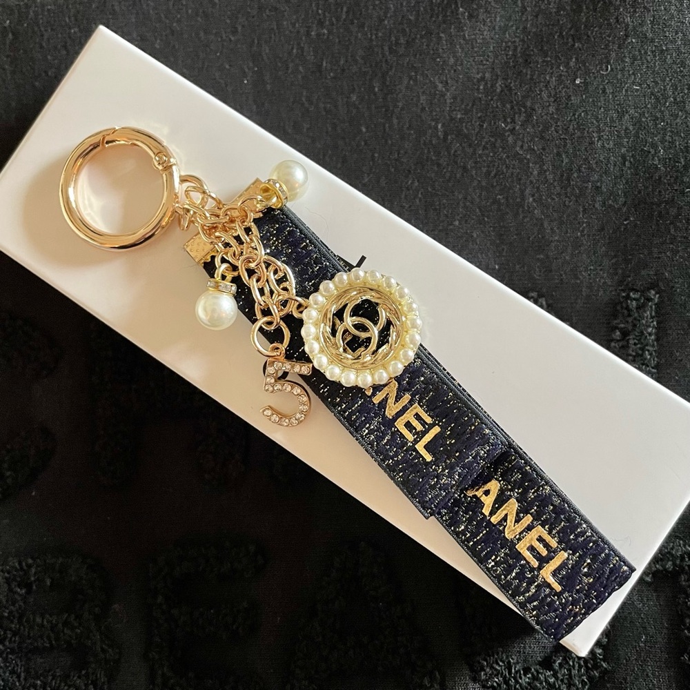 Brand New in Box Chanel Black and Gold Keychain/Bag Charm